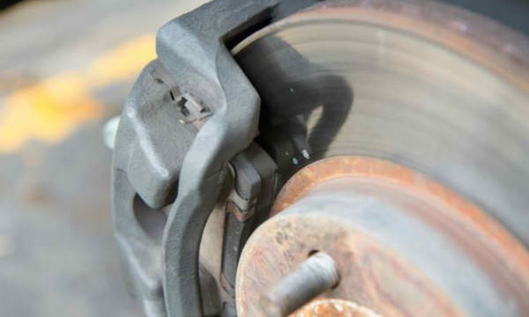 Inspect the brakes and replace brake pads if worn